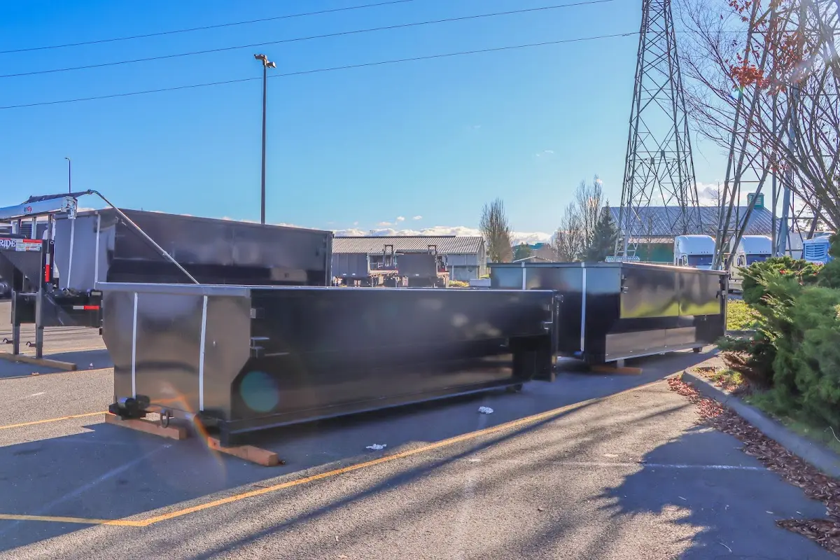 Roll-off dumpster ready for waste disposal at job site for Yard Waste Dumpster Rental in Sandown